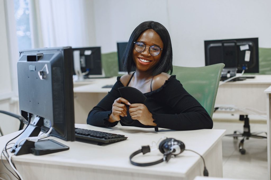 A professional working at a desktop workstation in an office