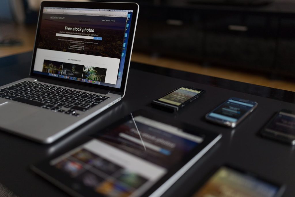 A website displayed on a laptop, tablet and phone side by side